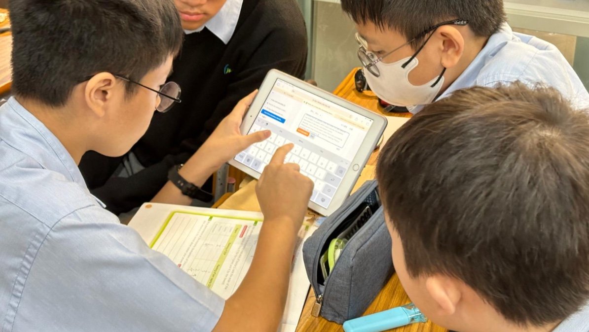 Students using tablet in classroom