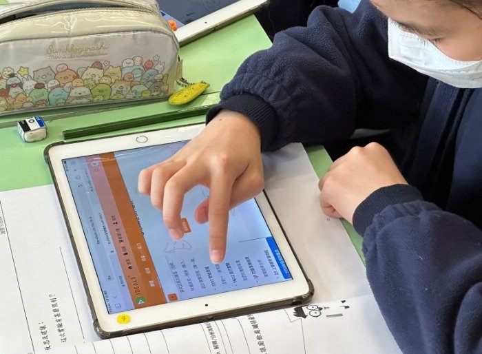 Student using tablet for learning